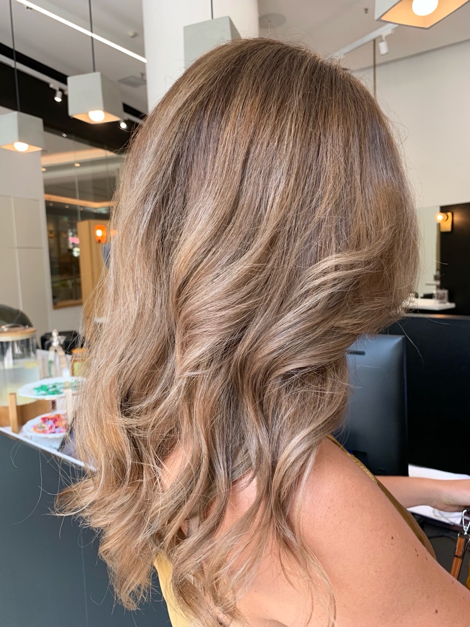 Client B after colour correction, showing a softer dimensional beige blonde result